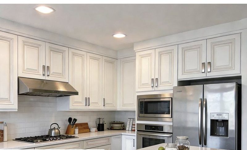 Antique White kitchen cabinets in a finished kitchen