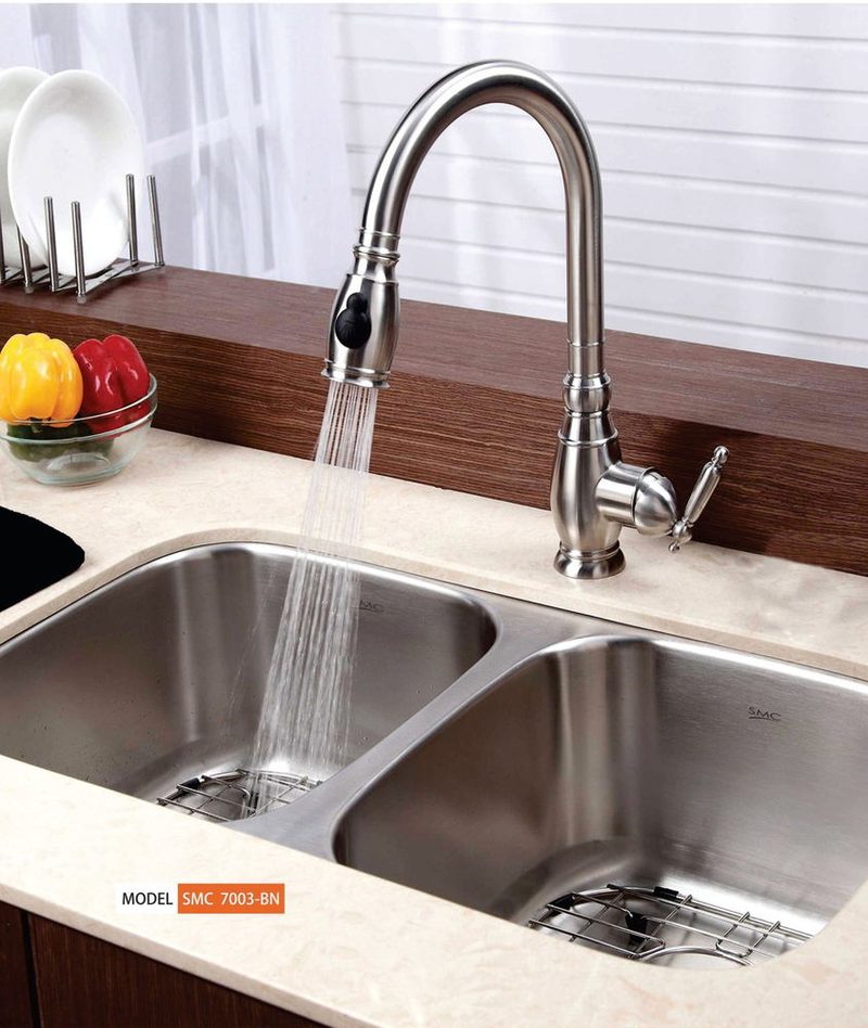 Double bowl undermount stainless sink with a pull-down faucet